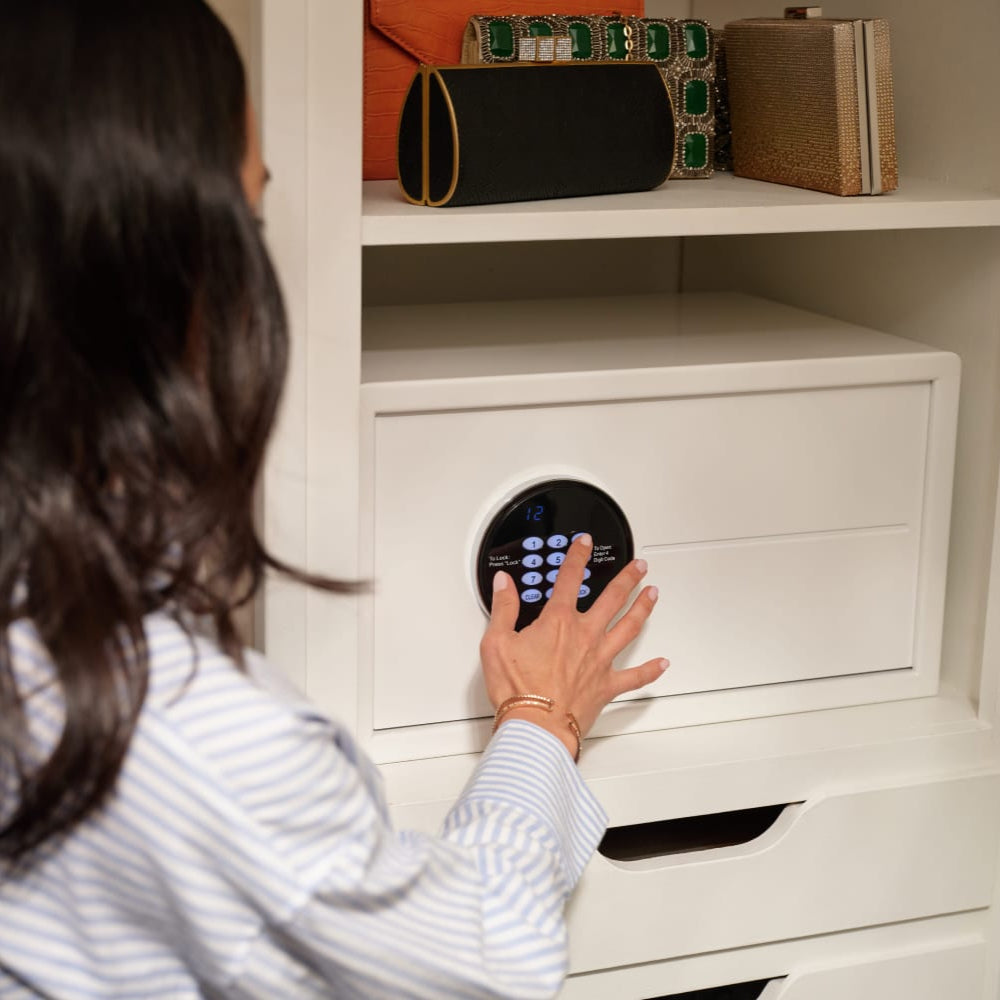 Lady using Keypad on Safe