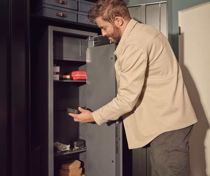 Man Opening Floorsafe in Garage