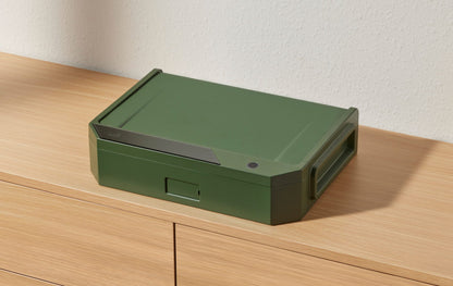 A green Camocube sitting at an angle
