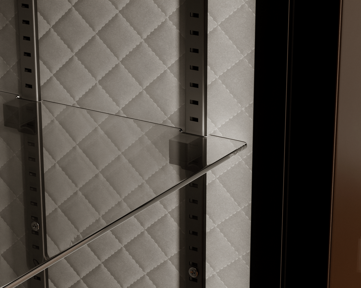 Mycube Glass in Onyx Black, close-up of a glass shelf on adjustable rails against quilted lining