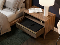 Mycube In-Drawer 23 inch safe in Onyx Black, three-quarter view closed inside an open bedside drawer