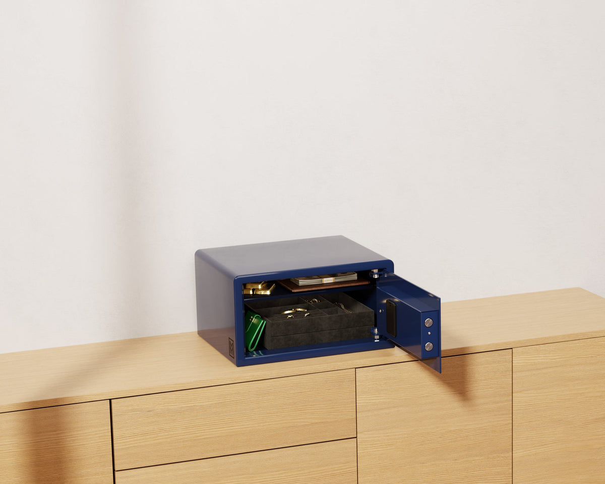 Mycube Mini safe in Midnight Blue with push-button keypad, three-quarter view with the door open