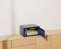 Mycube Mini safe in Midnight Blue with biometric touchpad, three-quarter view with the door open
