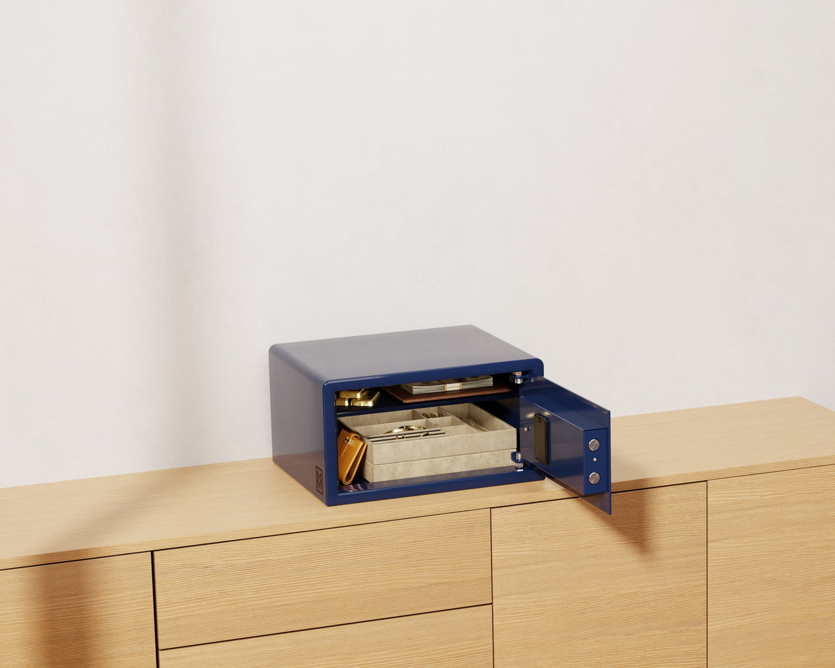 Mycube Mini safe in Midnight Blue with biometric touchpad, three-quarter view with the door open