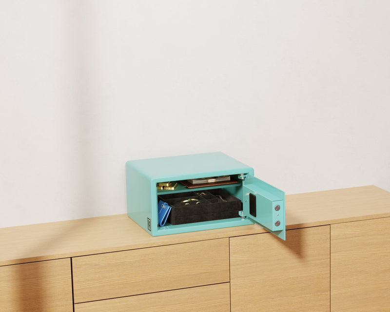 Mycube Mini safe in Robin's Egg Blue with biometric touchpad, three-quarter view with the door open