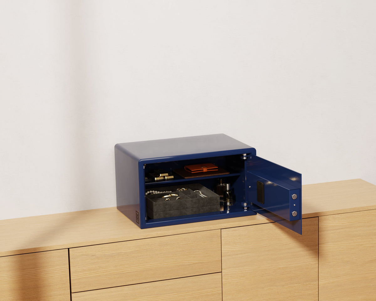 Mycube Classic safe in Midnight Blue with biometric touchpad, three-quarter view with the door open