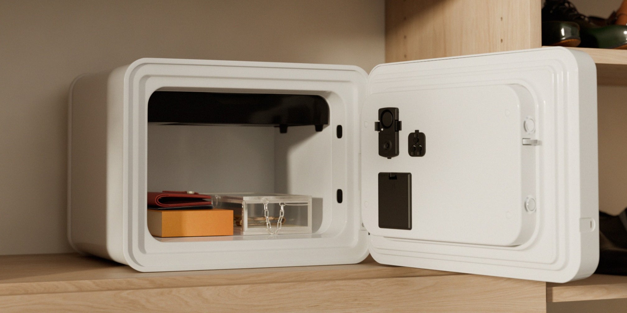 Mycube Fire safe open on a closet shelf showing protected valuables