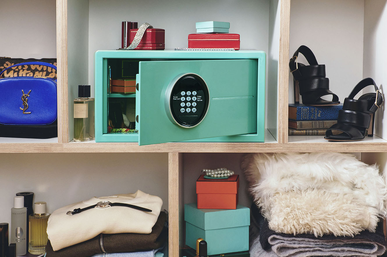 Tiffany blue Mycube Mini sitting on a shelf the with safe door open displaying the removable shelf within the safe