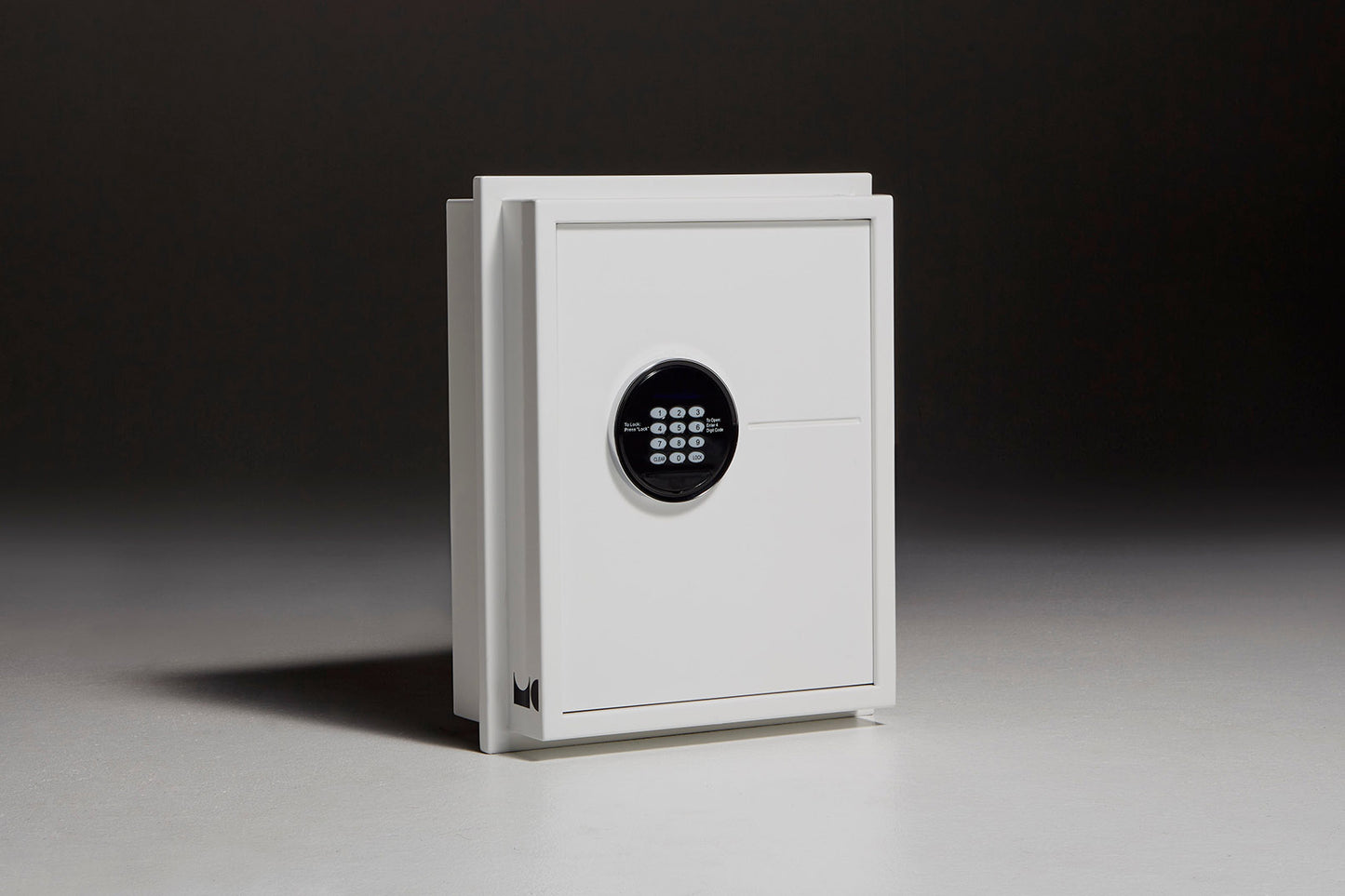 White wall safe sitting in front of black backdrop